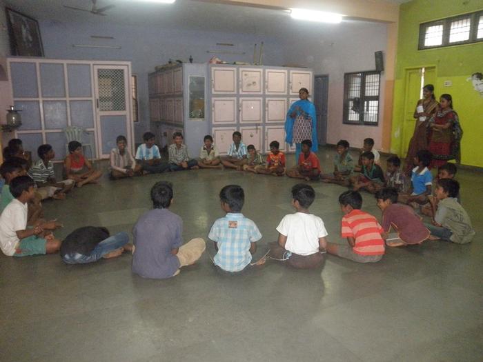 Children learning and growing through team games in the common room of the shelter