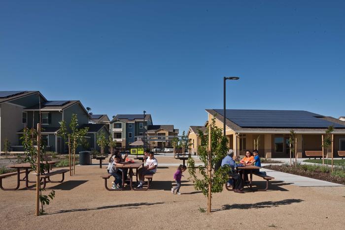 Housing funded by LIHTC 9% program: includes communal gathering space, solar and landscaping