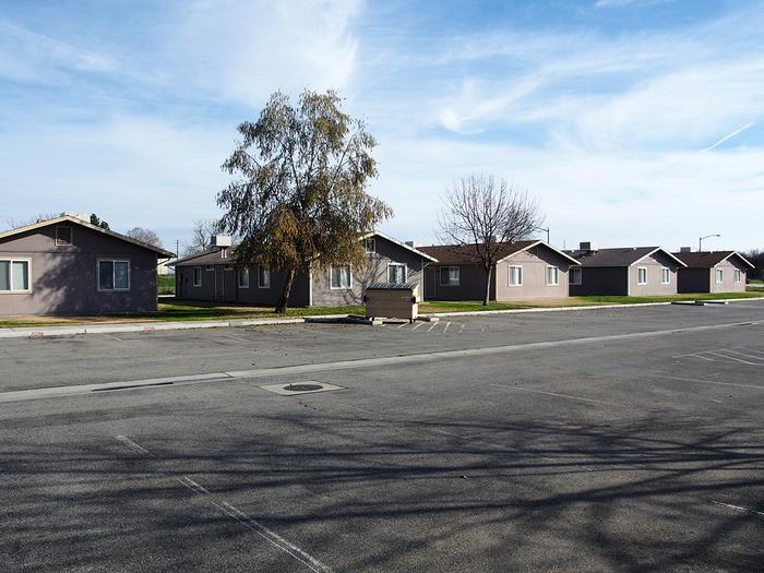 OMS migrant farmer housing center in Shafter, California: public space replaced by parking