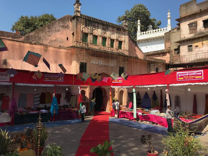 A printed fabric and handloom exhibition of the Bagh print at the entrance of Gohar Mahal