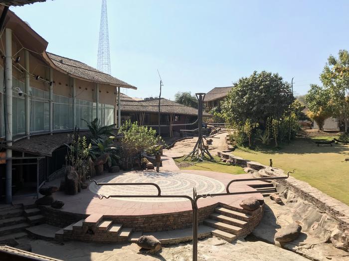 A panoramic view of the galleries at Tribal Museum with the amphitheatre in the forefront.