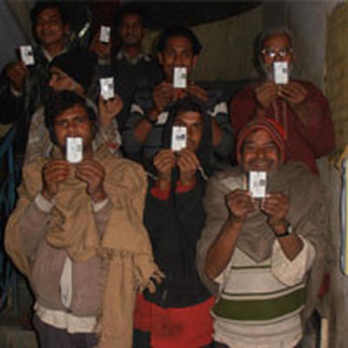 Homeless citizens being clicked with their national identity card helping them secure their rights.