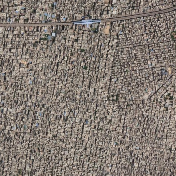 This satellite image of informal settlements in Uttam Nagar indicates a population density of 36,155 persons per square kilometer. The urban grain of this housing settlement is testament to the susceptibility to crime of the region and the need for innovation in housing in New Delhi. 

