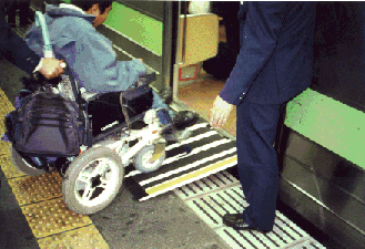 Small portable ramps can provide inexpensive access in many rail stations, as shown here in Tokyo.