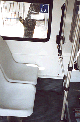 One such feature is this priority seating located behind the driver where there is extra leg room and it is easier for blind passengers to hear the driver call out key stops.<br>Photo by T. Rickert, courtesy of DFID (UK) and TRL (UK).