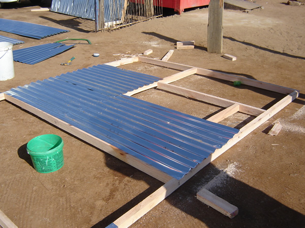 Local Resource and skills - use of sheet and timber to make house panel