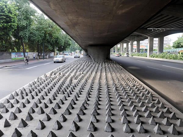 Concrete spikes under a bridge in Guangzhou City, China. Photo by Christopher Herring.