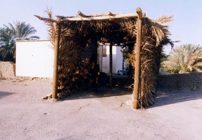 An under construction local emergency shelter with wooden structure in Bam
