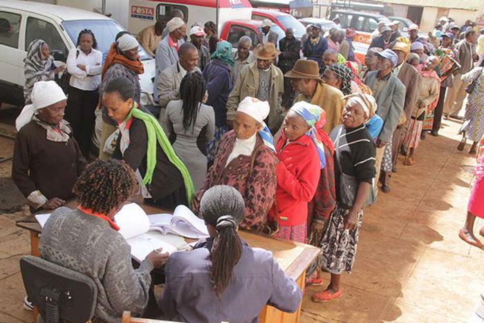 This photo shows elderly persons lining up to receive a stipend.